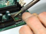 image of circuit board being soldered